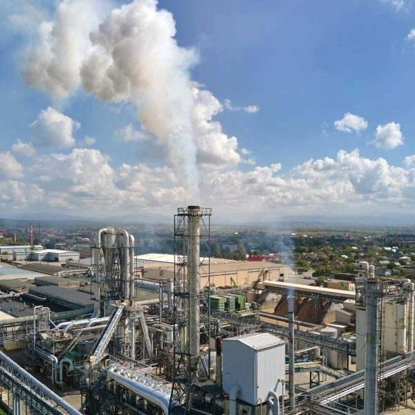 Aerial view of oil and gas refining petrochemical factory with high refinery plant manufacture